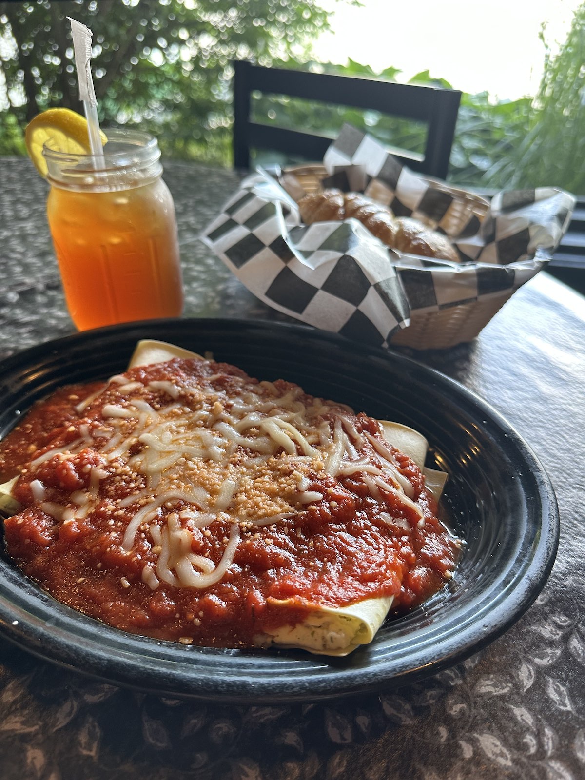 Rich ricotta-stuffed manicotti topped with savory marinara sauce and a blend of melted Italian cheeses, presented at The Italian Oven in Somerset, PA
